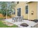 Backyard patio with furniture, a fire pit, well kept grass and partial fence at 828 Lehigh Cir, Erie, CO 80516