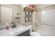 Bathroom featuring a sink, toilet, and shower at 828 Lehigh Cir, Erie, CO 80516