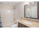 Bathroom with shower over tub, granite countertop and modern fixtures at 828 Lehigh Cir, Erie, CO 80516