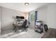 A bright bedroom featuring a large window, desk, and two monitors at 828 Lehigh Cir, Erie, CO 80516