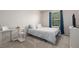 Bedroom with a window, queen bed, and vanity at 828 Lehigh Cir, Erie, CO 80516