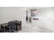 Hallway with neutral tones, a view to a bedroom, and a small workspace at 828 Lehigh Cir, Erie, CO 80516