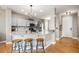 Modern kitchen with stainless steel appliances, ample counter space, and breakfast bar seating at 828 Lehigh Cir, Erie, CO 80516