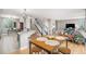 Bright and open living room with a view of the dining area and stairway at 828 Lehigh Cir, Erie, CO 80516