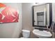 Chic powder room featuring modern fixtures, stylish mirror, and a sink at 828 Lehigh Cir, Erie, CO 80516