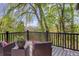 Relaxing outdoor deck area with beautiful views, table, chairs, and a decorative flower pot at 2635 S Lamar Way, Lakewood, CO 80227