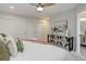Bright bedroom with a ceiling fan, white sliding-door closet and decorated console table at 2635 S Lamar Way, Lakewood, CO 80227