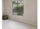 Bedroom with neutral carpet, gray walls, a window overlooking greenery, and a woven basket at 2635 S Lamar Way, Lakewood, CO 80227