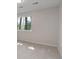 Spacious bedroom with large window allowing ample light and scenic views at 2635 S Lamar Way, Lakewood, CO 80227