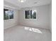 Bright bedroom with two windows offering scenic views and soft natural light at 2635 S Lamar Way, Lakewood, CO 80227