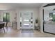 Inviting entryway with contemporary design, light wood floors, and ample natural light at 2635 S Lamar Way, Lakewood, CO 80227