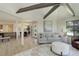 Bright, open-concept living room featuring high ceilings, modern furnishings, and large windows at 2635 S Lamar Way, Lakewood, CO 80227