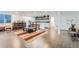 Spacious basement featuring a built-in bar, laminate flooring, and natural light at 149 Jewel St, Brighton, CO 80603