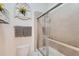 Tidy bathroom featuring a tiled shower with glass doors and decorative accents at 149 Jewel St, Brighton, CO 80603