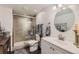 Modern bathroom features tiled shower with glass doors and single sink at 149 Jewel St, Brighton, CO 80603