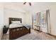 Comfortable bedroom with carpet, vaulted ceilings, and natural light from large windows at 149 Jewel St, Brighton, CO 80603