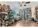 Spacious den featuring hardwood floors and custom shelving for collectibles at 149 Jewel St, Brighton, CO 80603