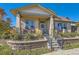 Inviting home with a cozy front porch, stone accents, and well-maintained landscaping at 149 Jewel St, Brighton, CO 80603
