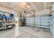 Spacious garage with ample storage, featuring an automatic overhead door at 149 Jewel St, Brighton, CO 80603