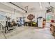 Spacious garage with ample lighting, workspace, and fitness equipment at 149 Jewel St, Brighton, CO 80603