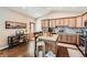 Inviting kitchen with wooden cabinets, center island, and stainless steel appliances at 149 Jewel St, Brighton, CO 80603