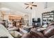 Open-concept living room flowing into the kitchen and dining area at 149 Jewel St, Brighton, CO 80603
