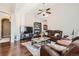Bright and airy living room featuring a ceiling fan and hardwood floors at 149 Jewel St, Brighton, CO 80603