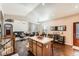 Open-concept living room with hardwood floors, large windows, and comfortable seating at 149 Jewel St, Brighton, CO 80603