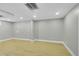 Finished basement room with recessed lighting, neutral colors and light hardwood floors at 7634 Navajo St, Denver, CO 80221
