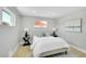 Serene bedroom with a cozy bed, neutral tones, and ample natural light at 7634 Navajo St, Denver, CO 80221