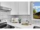 Close-up of the countertops, backsplash, and kitchen appliances at 7634 Navajo St, Denver, CO 80221