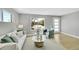 Bright living room with hardwood floors, natural light, and stylish decor at 7634 Navajo St, Denver, CO 80221