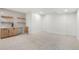 Finished basement with a wet bar, neutral carpet and modern finishes at 3049 S Cherokee St, Englewood, CO 80110