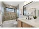 Stylish bathroom with patterned tile, modern fixtures and vanity with white countertop at 3049 S Cherokee St, Englewood, CO 80110