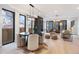 Open-concept dining room filled with natural light, contemporary decor, and sleek hardwood floors at 3049 S Cherokee St, Englewood, CO 80110