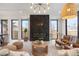 Relaxing living room showcases a stylish fireplace, natural light, and inviting seating arrangements at 3049 S Cherokee St, Englewood, CO 80110