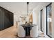 Open-concept living space with dining area and kitchen in view, emphasizing modern design and functionality at 3049 S Cherokee St, Englewood, CO 80110