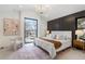 Bright main bedroom with a large window, modern decor, and a comfortable, inviting atmosphere at 3049 S Cherokee St, Englewood, CO 80110