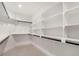 Spacious walk-in closet with custom shelving and modern finishes at 3049 S Cherokee St, Englewood, CO 80110