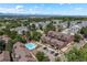 An aerial view of the community and pool, showcasing the surrounding neighborhood with mountain views at 311 W Lehow Ave # 3, Englewood, CO 80110