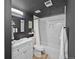 This bathroom features a modern vanity, stylish mirror, and a newly renovated shower with marble accents at 311 W Lehow Ave # 3, Englewood, CO 80110