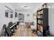 This dining room offers a blend of utility and style, featuring built in shelving and bright, neutral paint at 311 W Lehow Ave # 3, Englewood, CO 80110