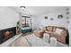 This well-lit living room showcases a fireplace, stylish seating, and inviting decor at 311 W Lehow Ave # 3, Englewood, CO 80110