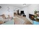 Bright living room features hardwood floors, fireplace, and modern furnishings, creating a cozy atmosphere at 311 W Lehow Ave # 3, Englewood, CO 80110