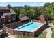 A refreshing community pool surrounded by lush greenery and charming fence detail at 311 W Lehow Ave # 3, Englewood, CO 80110