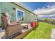 Backyard patio features comfortable outdoor seating with lawn and garden views at 19771 E Wesley Pl, Aurora, CO 80013
