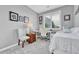 Bedroom with study area, desk and chair, large window with blinds, and comfortable bed at 19771 E Wesley Pl, Aurora, CO 80013