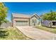 Charming single Gathering home with brick accents, attached garage, and mature landscaping at 19771 E Wesley Pl, Aurora, CO 80013
