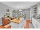 Spacious kitchen with beautiful island, wood floors, stainless sink, and dining area with lots of sunlight at 19771 E Wesley Pl, Aurora, CO 80013