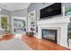 Open-concept living room with fireplace and view to second living area at 19771 E Wesley Pl, Aurora, CO 80013